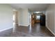 Open-concept view showcasing the kitchen with wooden cabinets and sleek black appliances at 4567 Parkway Cir, Atlanta, GA 30349
