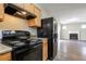 Functional kitchen with modern appliances and seamless view into the living room with fireplace at 4567 Parkway Cir, Atlanta, GA 30349