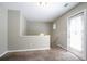Cozy carpeted upper landing area with a glass-paned door leading to the outside at 4567 Parkway Cir, Atlanta, GA 30349