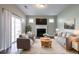 Cozy living room with a fireplace, plush seating, and stylish decor, perfect for relaxation and entertaining guests at 4567 Parkway Cir, Atlanta, GA 30349