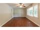 Bright living room with hardwood flooring, ceiling fan, and natural light from a large window at 4567 Parkway Cir, Atlanta, GA 30349
