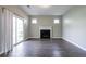 The living room has hardwood floors, sliding glass doors to the exterior and a modern fireplace at 4567 Parkway Cir, Atlanta, GA 30349