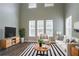 Bright living room with soaring ceilings, modern decor, and ample natural light for a comfortable living space at 4567 Parkway Cir, Atlanta, GA 30349
