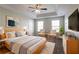 Serene main bedroom with tray ceilings, neutral tones, and comfortable furnishings, creating a relaxing retreat at 4567 Parkway Cir, Atlanta, GA 30349