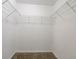 Walk-in closet with built-in shelving offers ample storage and organization space at 4567 Parkway Cir, Atlanta, GA 30349
