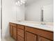 Double sink vanity bathroom with white countertop and wood cabinets at 4902 Pleasantry Way, Acworth, GA 30101