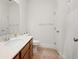 Bathroom with tile floor, white walls, and standard toilet and sink at 4902 Pleasantry Way, Acworth, GA 30101