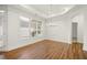 Bright dining room with hardwood floors, large window, and modern chandelier at 4902 Pleasantry Way, Acworth, GA 30101