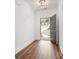 Entryway with hardwood floors, white walls, and a gray door with a view to the exterior at 4902 Pleasantry Way, Acworth, GA 30101