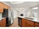 Gourmet kitchen open to the living area, featuring granite countertops and stainless steel appliances at 4902 Pleasantry Way, Acworth, GA 30101