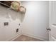 Clean laundry room with tile flooring and a shelf at 4902 Pleasantry Way, Acworth, GA 30101