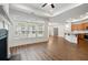 Open-concept living space flows into a modern kitchen with granite countertops and stainless steel appliances at 4902 Pleasantry Way, Acworth, GA 30101