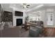 Staged living room with hardwood floors, a fireplace, and recessed lighting with lots of natural light at 4902 Pleasantry Way, Acworth, GA 30101