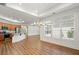 Open-concept living room, kitchen with stainless steel appliances, and hardwood flooring at 4902 Pleasantry Way, Acworth, GA 30101