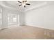 Large main bedroom with tray ceiling and neutral carpet at 4902 Pleasantry Way, Acworth, GA 30101
