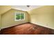 Bedroom featuring hardwood floors and a large window with natural light at 507 Cross Creek Pt, Stone Mountain, GA 30087