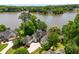 Lakefront home with lush greenery, beautiful landscaping, and serene water views at 507 Cross Creek Pt, Stone Mountain, GA 30087