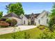 Elegant home featuring a three car garage, lush landscaping, and a circular driveway at 507 Cross Creek Pt, Stone Mountain, GA 30087