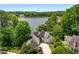 Stunning waterfront home with lush landscaping, private drive and lake view at 507 Cross Creek Pt, Stone Mountain, GA 30087