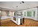 Kitchen with marble island, stainless steel appliances and wood flooring at 507 Cross Creek Pt, Stone Mountain, GA 30087