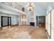Spacious living room with a fireplace, vaulted ceiling, and a second-story balcony, offering a unique architectural design at 507 Cross Creek Pt, Stone Mountain, GA 30087