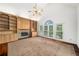 Living room featuring built-in shelving, fireplace, and large window at 507 Cross Creek Pt, Stone Mountain, GA 30087