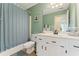 Fresh bathroom with a shower/tub combo and white vanity at 113 Westchester Xing, Canton, GA 30115