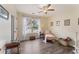Sunlit bedroom with hardwood floors, perfect for a home office or guest room at 113 Westchester Xing, Canton, GA 30115