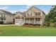 Charming two-story home with a welcoming front porch, attached two-car garage, and landscaped yard at 113 Westchester Xing, Canton, GA 30115