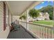 Inviting front porch with hanging ferns, offering a relaxing outdoor space at 113 Westchester Xing, Canton, GA 30115