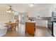Bright kitchen with white cabinets, stainless steel appliances, and a cozy breakfast nook at 113 Westchester Xing, Canton, GA 30115