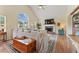 Spacious living room with vaulted ceiling, fireplace, and large window at 113 Westchester Xing, Canton, GA 30115