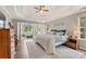 Spacious main bedroom with tray ceilings, sitting area, and large windows at 113 Westchester Xing, Canton, GA 30115