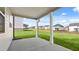 Spacious backyard features a covered patio and a well-maintained lawn, great for outdoor enjoyment at 1149 Blue Juniper Cir, Loganville, GA 30052