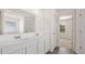 Bathroom featuring a large vanity with double sinks and grey tile flooring at 1149 Blue Juniper Cir, Loganville, GA 30052