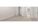 Bright bedroom features neutral carpeting, white walls, closet, and exterior views at 1149 Blue Juniper Cir, Loganville, GA 30052