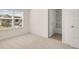 Bedroom with a window, blinds, views to exterior and attached bathroom at 1149 Blue Juniper Cir, Loganville, GA 30052