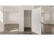 View of the interior includes an open closet and shows a bedroom and hallway, with modern hard surface flooring at 1149 Blue Juniper Cir, Loganville, GA 30052