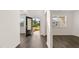 Bright entryway featuring a large window and an open door, revealing the exterior view, complemented by hard surface flooring at 1149 Blue Juniper Cir, Loganville, GA 30052