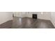 Open-concept view with fireplace, hard flooring, and natural light at 1149 Blue Juniper Cir, Loganville, GA 30052