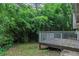 Wooden deck with trees in the background, perfect for relaxing at 4634 Garden Hills Dr, Stone Mountain, GA 30083