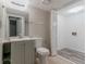 Bright bathroom featuring a vanity, toilet, and laundry hookups at 4634 Garden Hills Dr, Stone Mountain, GA 30083