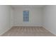 Carpeted bedroom with window and closet at 4634 Garden Hills Dr, Stone Mountain, GA 30083