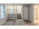 Well-lit living room with staircase and partial view of a bathroom at 4634 Garden Hills Dr, Stone Mountain, GA 30083