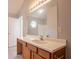 Bathroom featuring a large vanity, a mirror, and a window that provides natural light at 7070 Ravenwood Ln, Lithonia, GA 30038