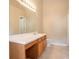 Well-lit bathroom featuring a large vanity with a spacious countertop and modern sink at 7070 Ravenwood Ln, Lithonia, GA 30038