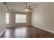 Bedroom with hard wood floors and a fan at 7070 Ravenwood Ln, Lithonia, GA 30038