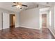 Bedroom with hardwood floors and two doors at 7070 Ravenwood Ln, Lithonia, GA 30038