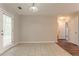 Bright dining area with tile floors and access to the backyard at 7070 Ravenwood Ln, Lithonia, GA 30038