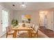 Eat-in dining area with stylish furniture, lighting, and walk-out to the backyard at 7070 Ravenwood Ln, Lithonia, GA 30038